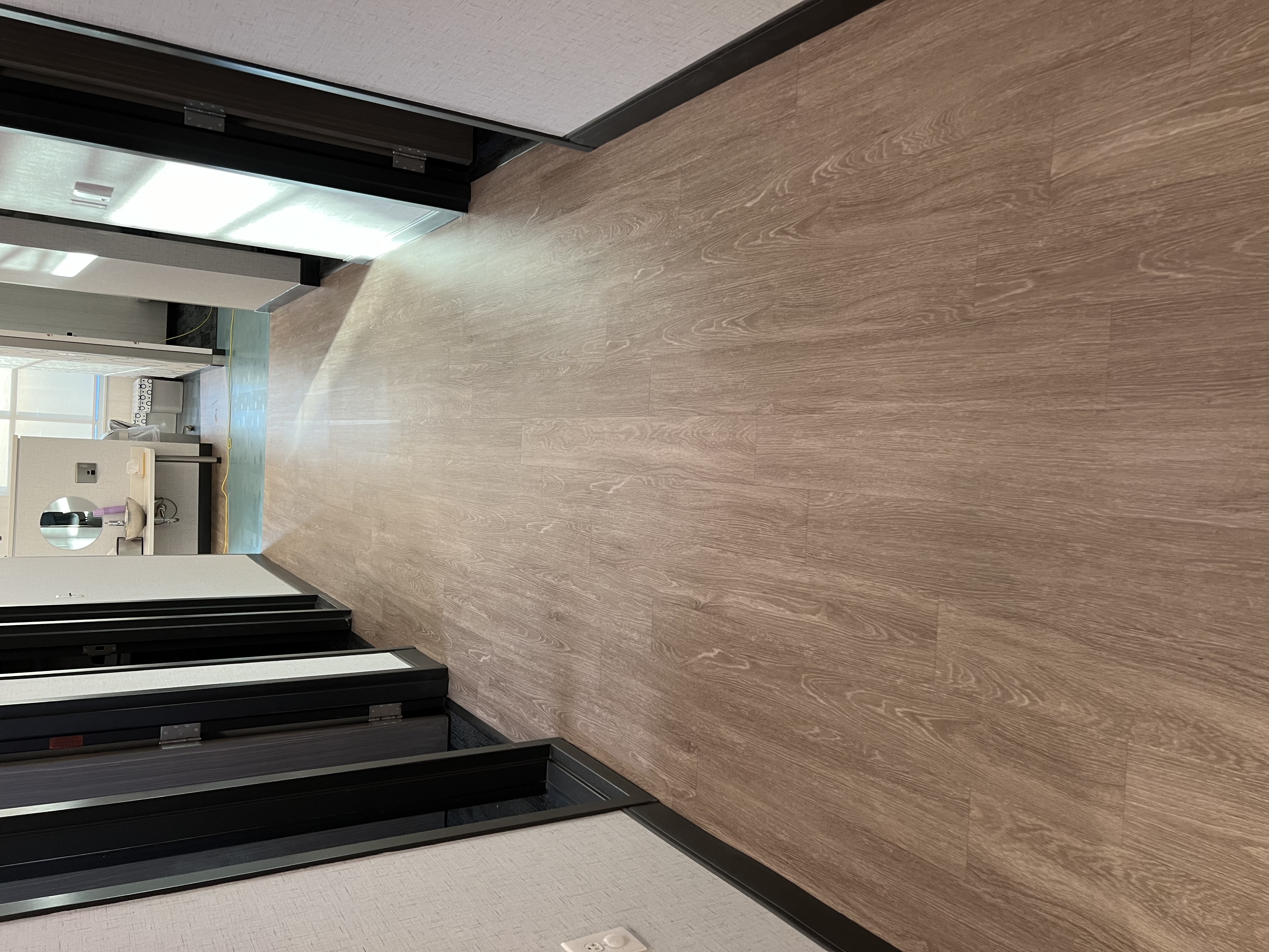 A photo of plank vinyl flooring restored to a beautiful shine.